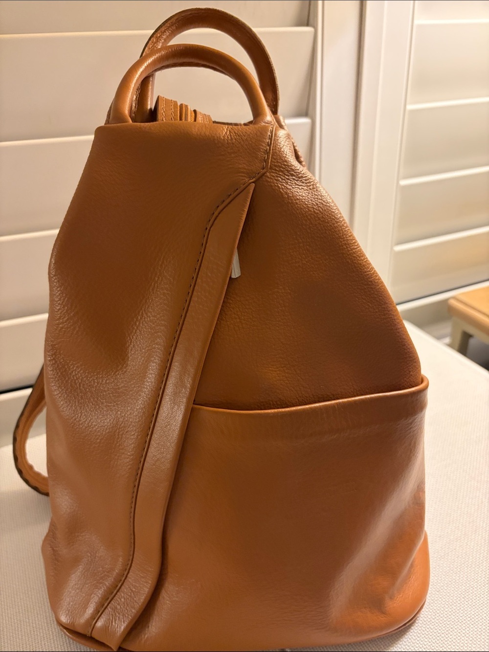 Italian Leather sling back pack by La Gaksta with variable carring options.